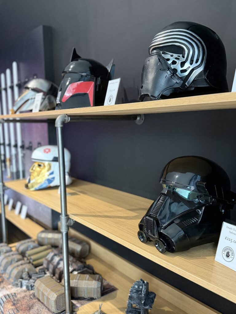 Collectable helmets on the shelves in the Worcester shop